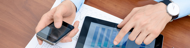man reviewing news and graphs