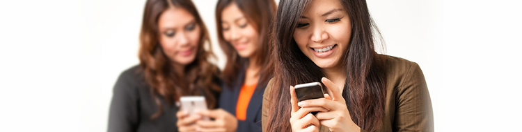 women looking at phones